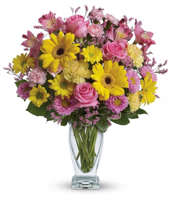 Pink roses, yellow mums and daisies in a vase