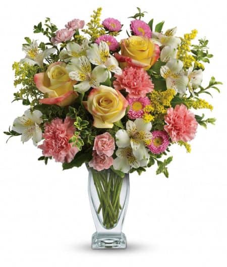 v lovely mix of yellow roses and pink carnations