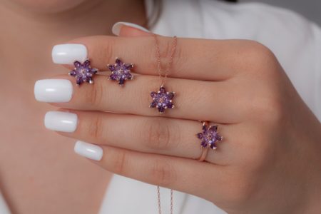 The young woman in a white dress and with white nail polish