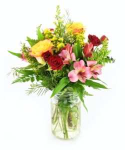 Countryside Kisses Bouquet. Pink, yellow, and red flowers with vibrant greenery.
