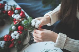 Christmas Decorations and Female Hands, Holiday Background